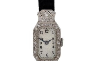PWC. A platinum and gold diamond set Art Deco cocktail wristwatch, Circa 1920 Silvered dial with black Arabic hourly numerals and outer five minute track, blued steel hands, Swiss manual wind movement, within a platinum, gold and diamond set hinged...