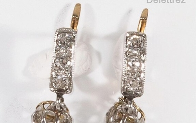 Pair of "Dormeuses" earrings in platinum and yellow gold, adorned...