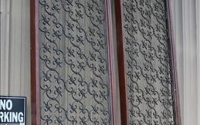 Pair of tall cast iron panels in Mahogany frames