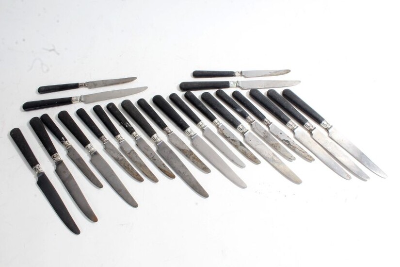 Set of eleven French steel and wooden handled table and dessert knives, the blades stamped "HORS