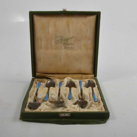 Set of six Norwegian white metal and blue enamel coffee spoons.