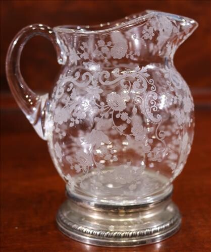 Small rose point pitcher with sterling base