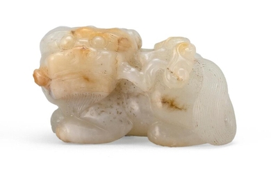 TRANSLUCENT RIVER PEBBLE JADE CARVING OF A RECLINING...