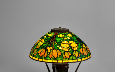 TIFFANY STUDIOS (1899-1930) Crocus Table Lampcirca 1910 on Urn Base, leaded glass and patinated bronze, shade stamped 'TIFFANY STUDIOS NEW YORK', base stamped 'TIFFANY STUDIOS NEW YORK 163'height 18 1/4in (46.5cm); diameter of shade 16in (39.5cm)