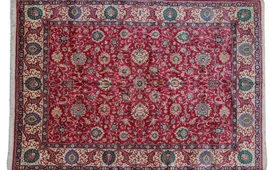 Tabriz Carpet North West Iran, circa 1950 The deep raspberry...