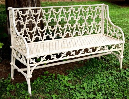 White cast iron garden bench designed back