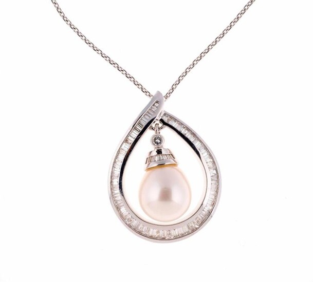 White gold pendant set with baguette diamonds holding in its...