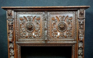 very important Renaissance style fireplace in walnut with brown patina