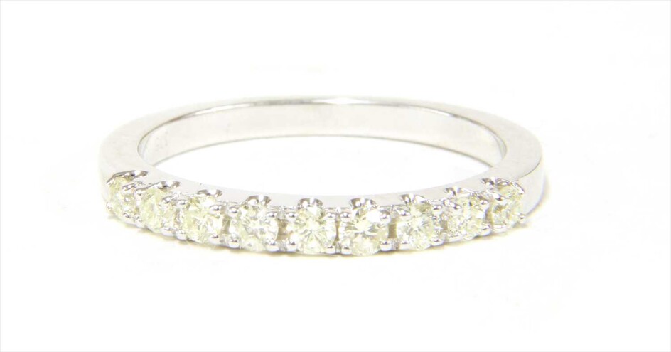 A 9ct white gold half eternity ring