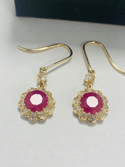 14ct Yellow Gold Ruby and Diamond earrings featuring,...