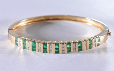 14k yellow gold, diamond, and emerald bracelet.