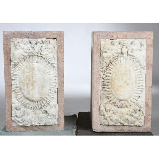 2 Pink granite SOCLES decorated with a Louis XIV white marble plaque with a sun in its center and framed with different allegories and divinities. The marble plates are late 17th century. (1 missing from a base). 45x23 Plinths 52x30x28.