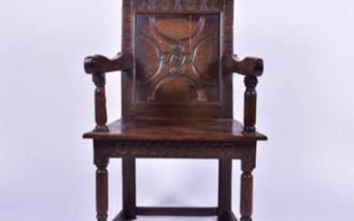An 18th century English wainscot oak chair with carved back rest made from a church coffer with Sussex pattern, above a...