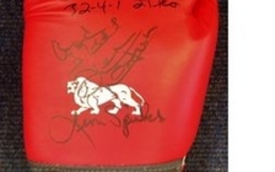 Boxing Lonsdale Glove signed by three heavyweight champions Smoking Joe Frazier, Ken Norton and Leon Spinks. Good condition...