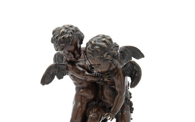 A bronze group of Cupids fighting for the human heart