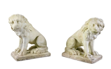 A PAIR OF CARVED MARBLE LIONS, seated, on rectangu…