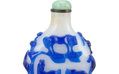 CHINESE OVERLAY GLASS SNUFF BOTTLE With blue design of eight horses on a milk-white ground. Height 2.25". Jadeite stopper.