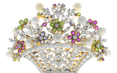 An Edwardian platinum and 18ct gold, pearl, demantoid garnet, ruby, sapphire and diamond floral basket brooch.