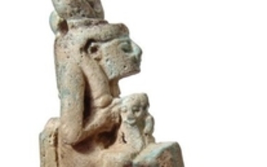 Egyptian faience amulet of Isis holding child Horus