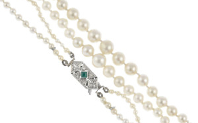 A natural pearl two-row necklace, with emerald and diamond clasp. View more details