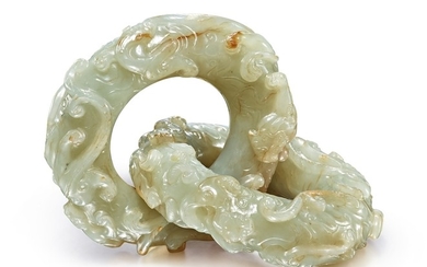 A RARE PAIR OF CELADON AND RUSSET JADE INTERLOCKING RINGS MING DYNASTY