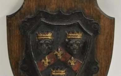A 19th century cast iron armorial shield, painted in