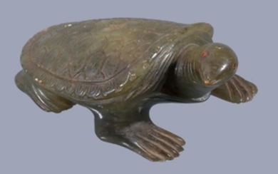 A Chinese green jade tortoise, with head turned to one