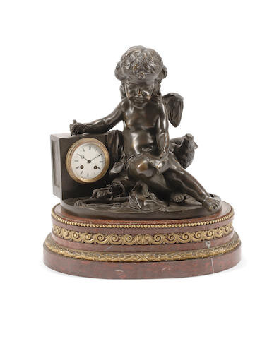 A Louis XVI Style Gilt Bronze Mounted Patinated Bronze and Rouge Griotte Marble Clock