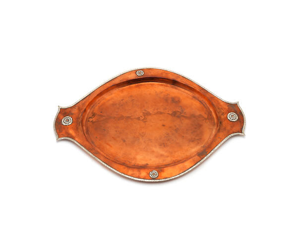 An Arts and Crafts copper and silver tray