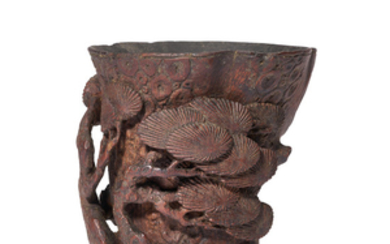 A CARVED ‘AGED PINE’ BAMBOO LIBATION CUP, QING DYNASTY (1644-1911)