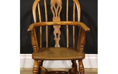 A 19th century ash and elm child’s Windsor rocking chair, pi...