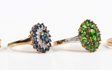 A 9ct gold, chrome diopside and diamond oval cluster ring, claw set with the principal oval cut chro