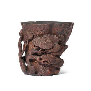 A CARVED ‘AGED PINE’ BAMBOO LIBATION CUP, QING DYNASTY (1644-1911)