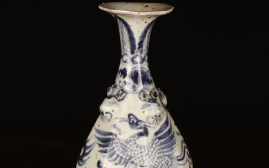 A Chinese Blue & White Stoneware Vase. The octagonal baluster body decorated with fenghuang amongst