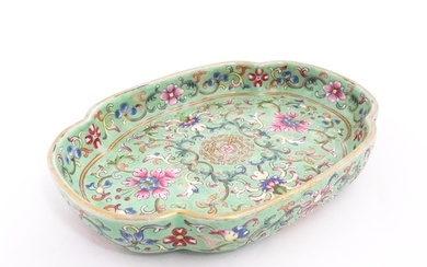 A Chinese famille rose dish with scrolling floral and foliat...
