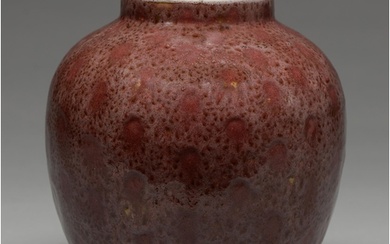 A Chinese flambe glazed jar, Qing dynasty, covered in a mott...