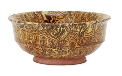 A Chinese marbled-pottery bowl, Tang dynasty, with steep straight sides...
