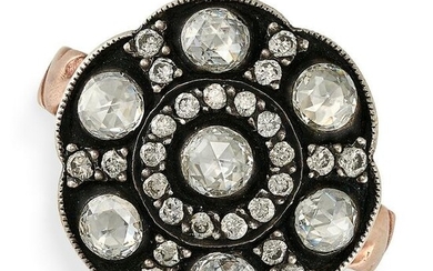 A DIAMOND CLUSTER RING set with a rose cut diamond in a border of round cut diamonds, accented by