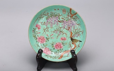 A FAMILLE ROSE TURQUOISE GROUND 'FLOWERS AND BIRD' DISH