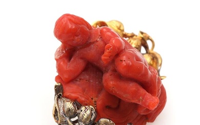 A French coral brooch set with carved coral i shape of figurine,...