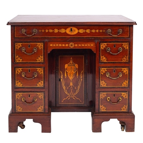 A George III mahogany and marquetry dressing table in the st...