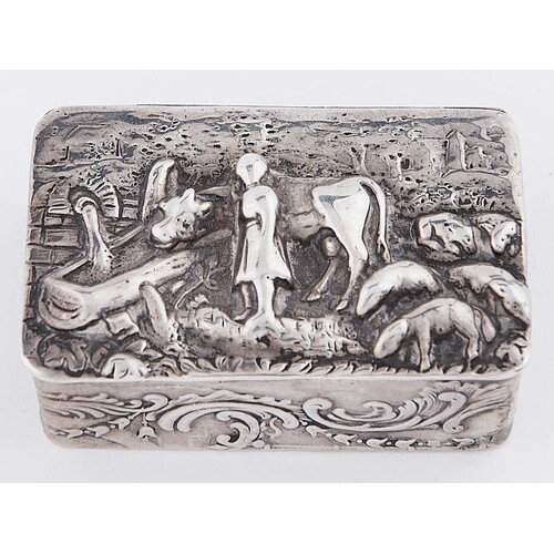 A German silver snuff box, the lid embossed in high relief w...