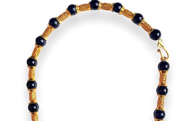 A Gold Tone and Bead Necklace
