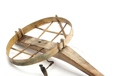A Greenlandic 20th century carved bone and wood kayak chair. H. 17. L. 50. W. 32 cm.