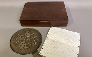 A Japanese Meiji period gilt bronze hand mirror, kagami, th...