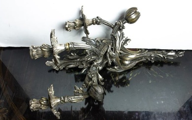 A Louis XV style silvered bronze four light bras de lumiere