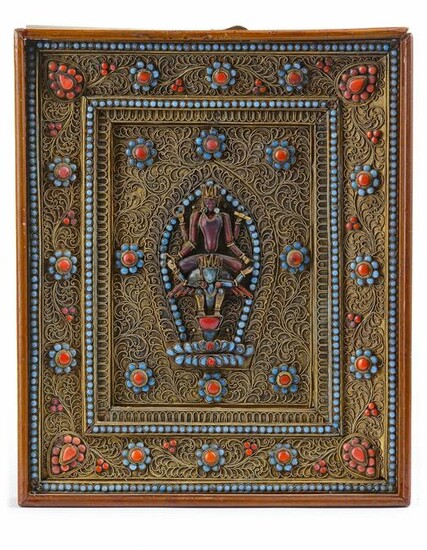 A NEPALESE GILT FILIGREE CORAL AND TURQUOISE- INLAID