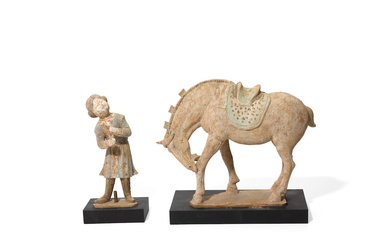 A PAINTED RED POTTERY GROOM AND A HORSE Tang dynasty...
