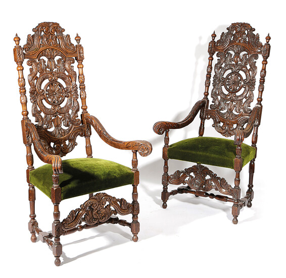 A PAIR OF CARVED OAK OPEN ARMCHAIRS IN CHARLES II STYLE