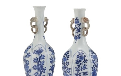 A PAIR OF CHINESE BLUE AND WHITE MOLDED VASES